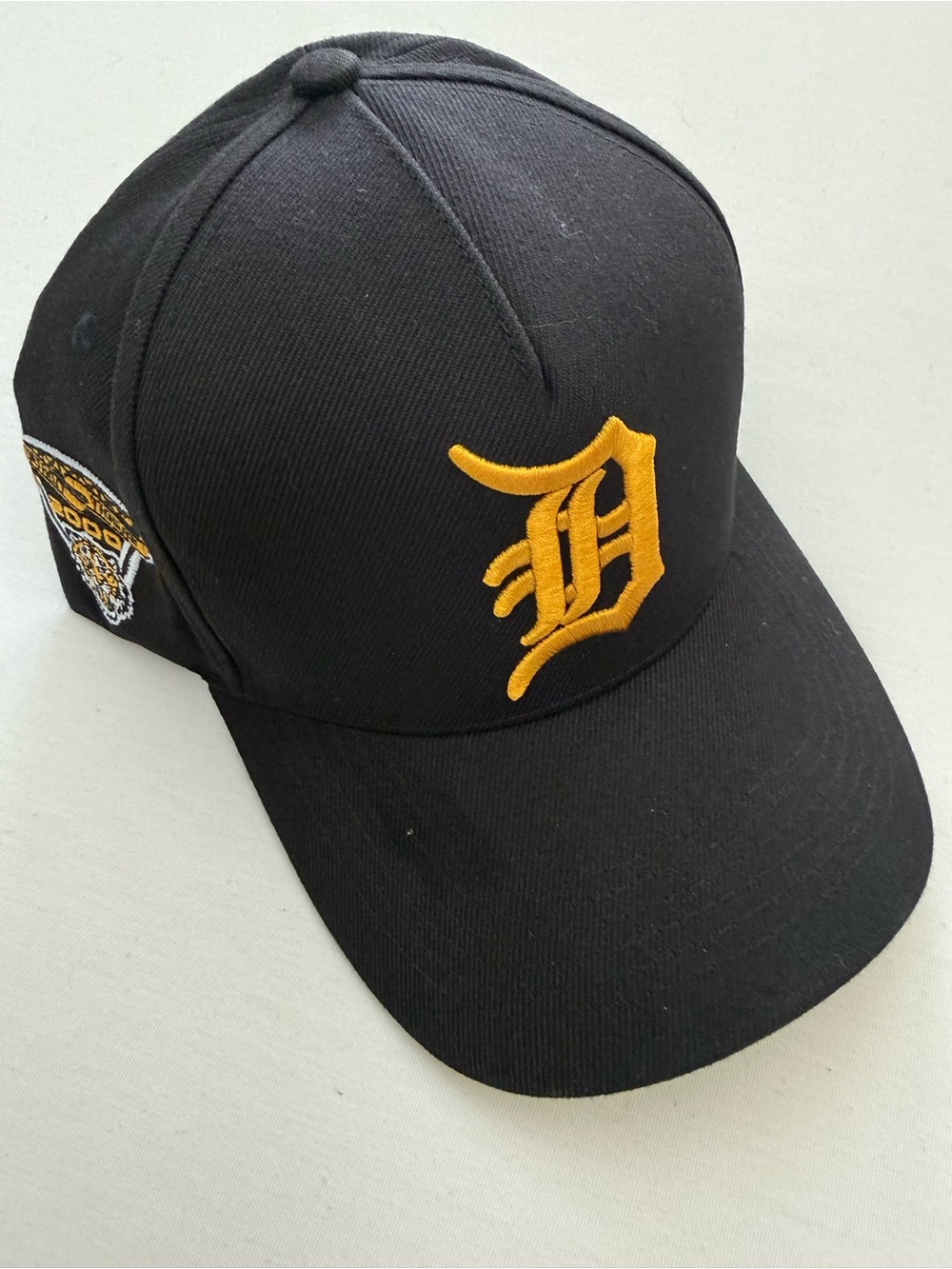 New Era Black Cap with Gold Embroidered D